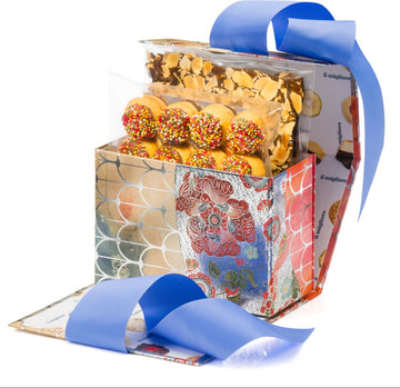 Gift box with colorful packaging and a blue ribbon on a white background