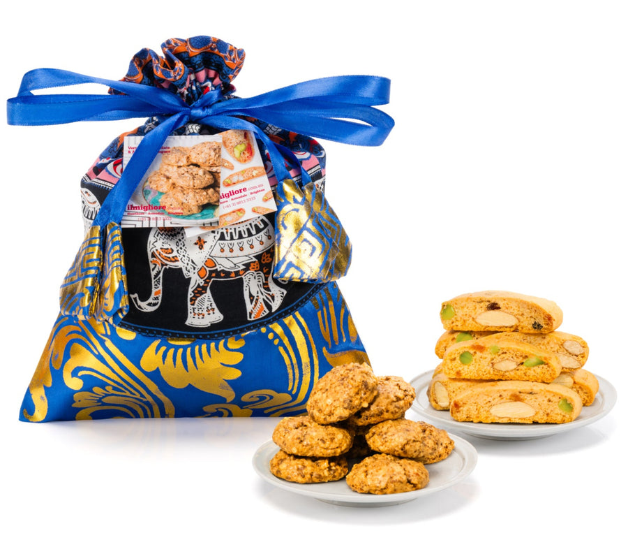 Gift bag with cookies and biscotti on a white background