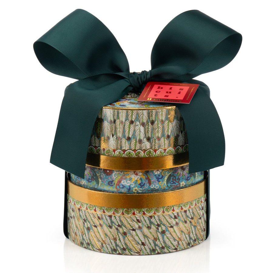 Decorative cylindrical gift with a green ribbon and gold band on a white background