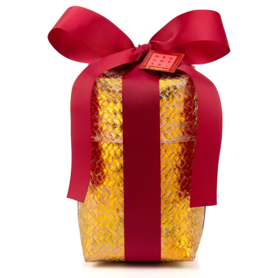 Gift box wrapped in gold paper with a red ribbon on a white background