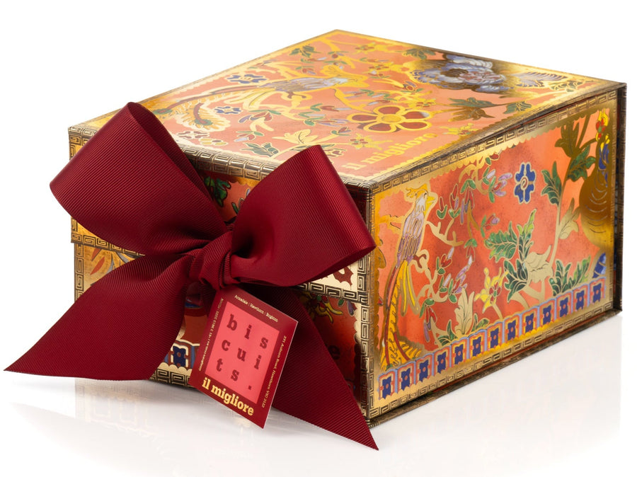 Decorative gift box with a red ribbon on a white background