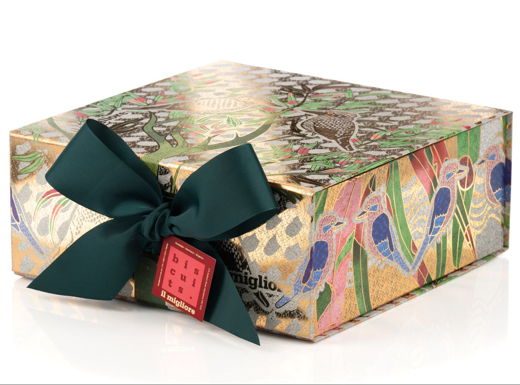 Decorative gift box with a colourful pattern and a green ribbon