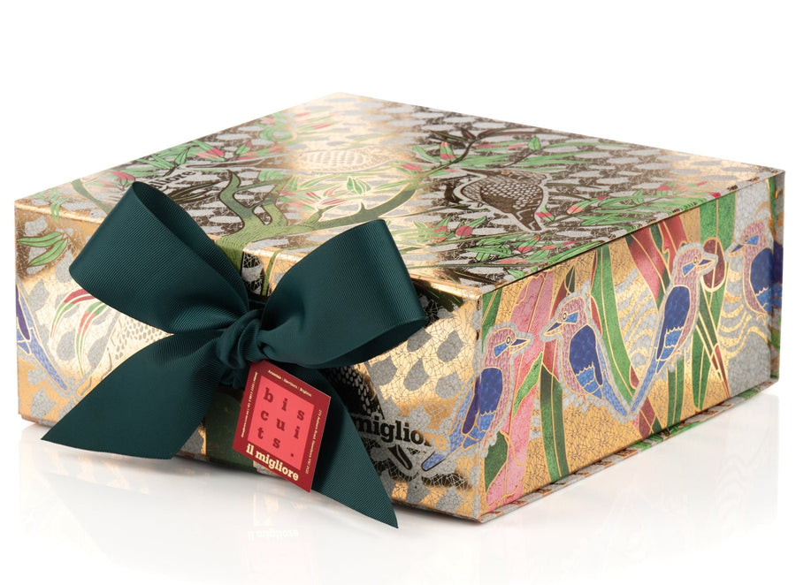 Decorative gift box with a colourful pattern and a green ribbon