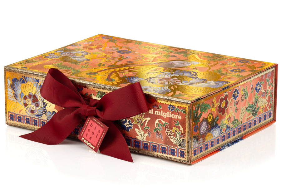 Decorative gift box with a red ribbon on a white background