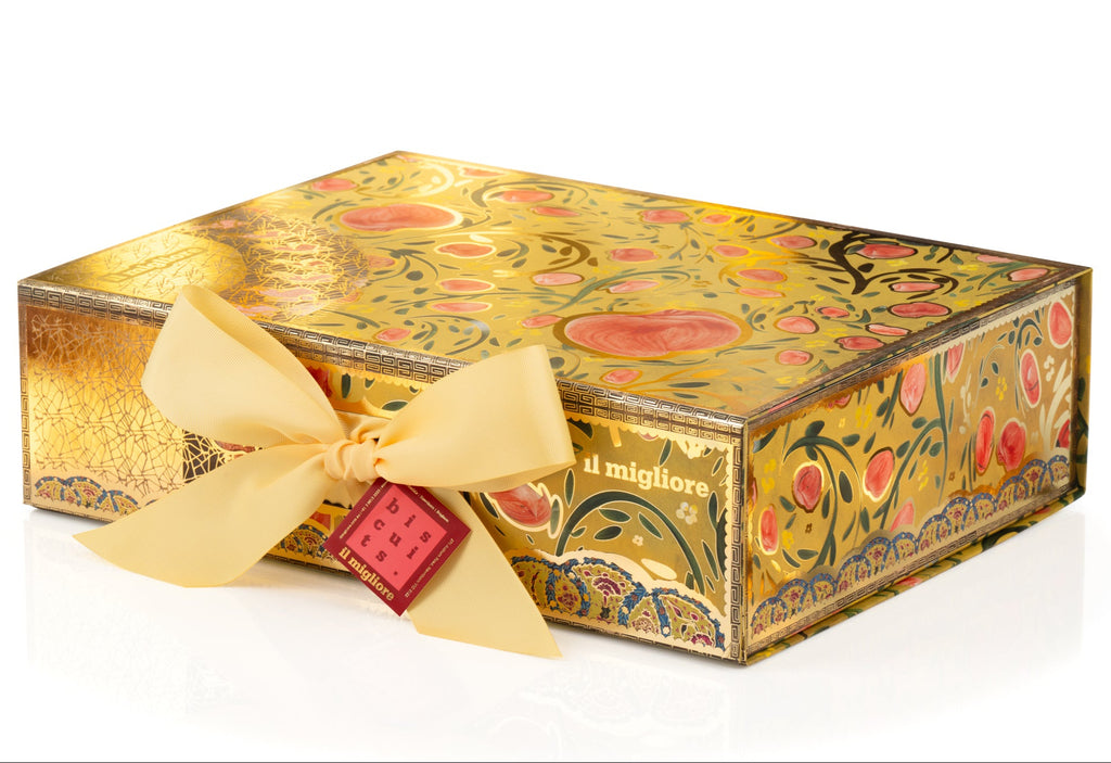 Decorative chocolate box with floral patterns and a yellow ribbon on a white background