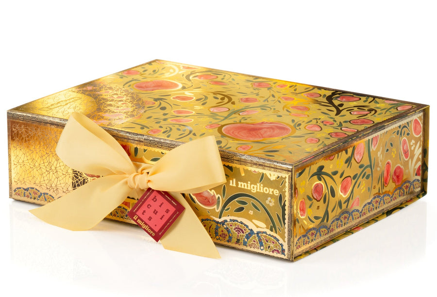 Decorative chocolate box with floral patterns and a yellow ribbon on a white background