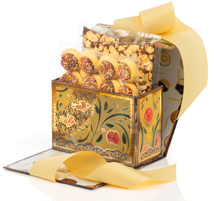 Decorative gift box with a bow filled with chocolates on a white background