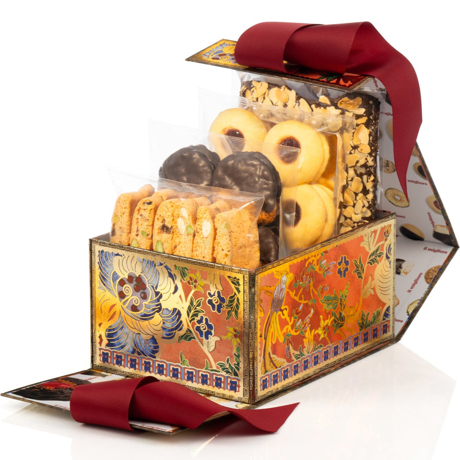 Decorative gift box with cookies and a red ribbon on a white background