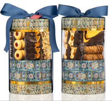Two cylindrical gift boxes with floral patterns and blue ribbons on a white background