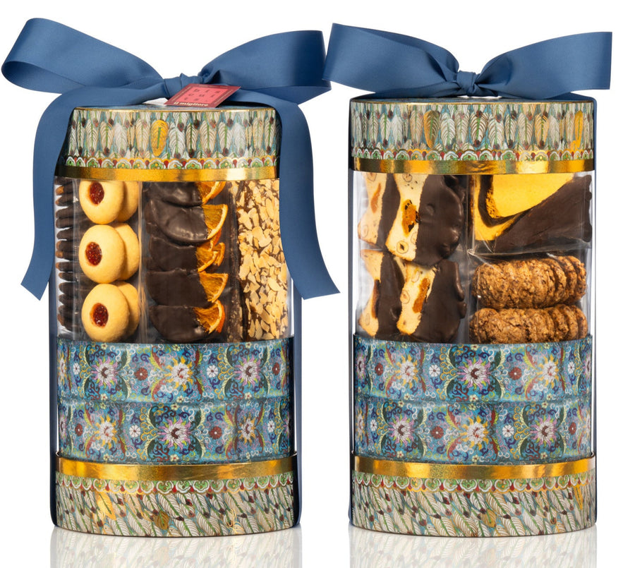 Two cylindrical gift boxes with floral patterns and blue ribbons on a white background