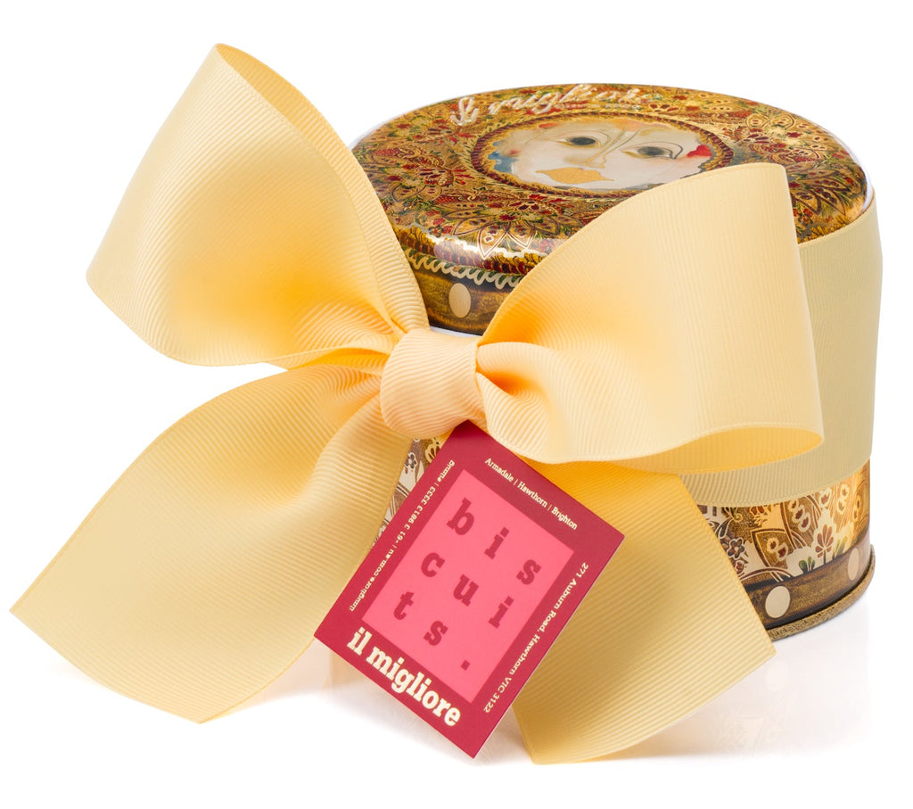 A stunning antique florentine pattern tin with a beautiful bow and delicious biscuits 